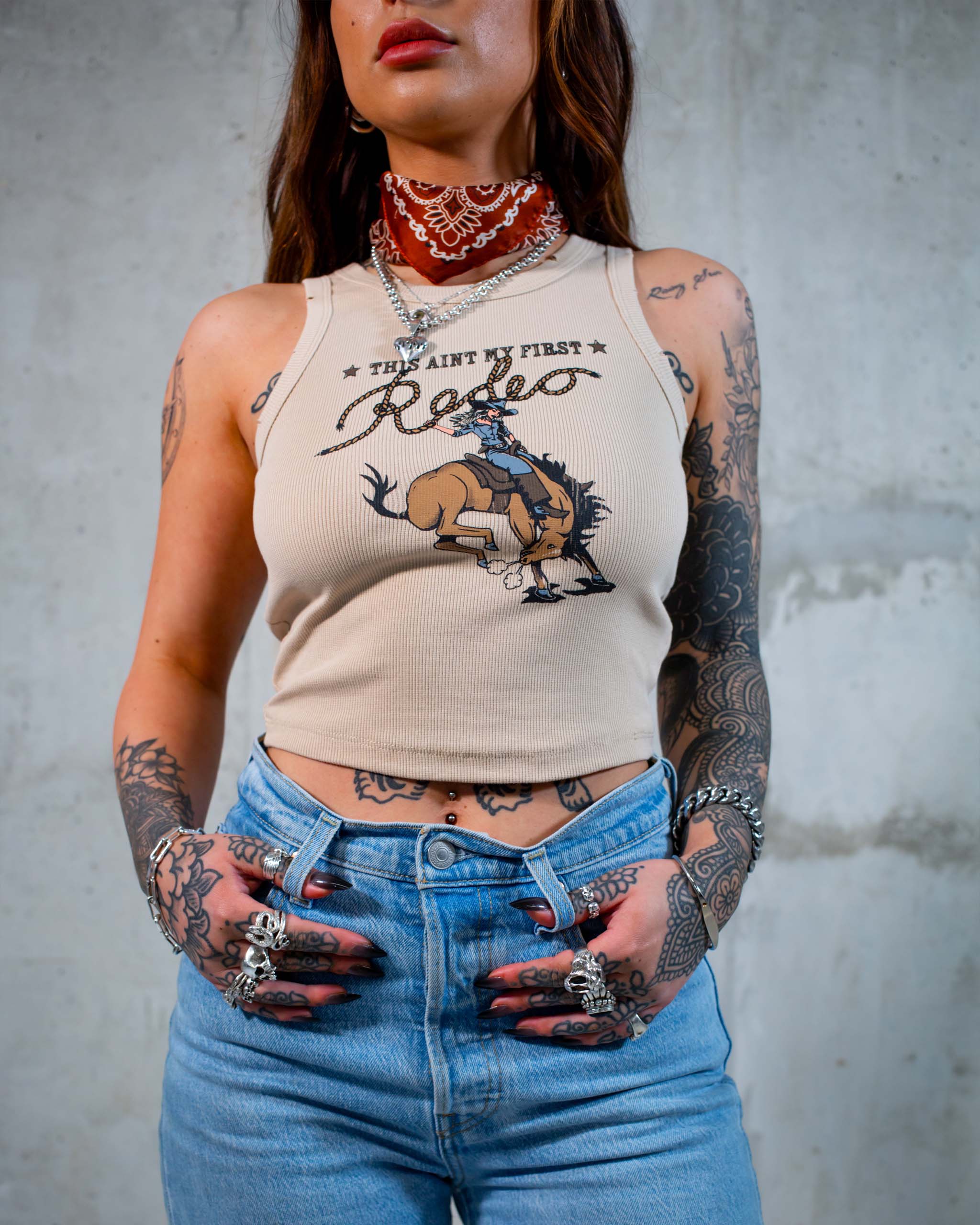This Ain't My First Rodeo tank top by Sleazy Rider, featuring a cowgirl on a bucking wild west horse.