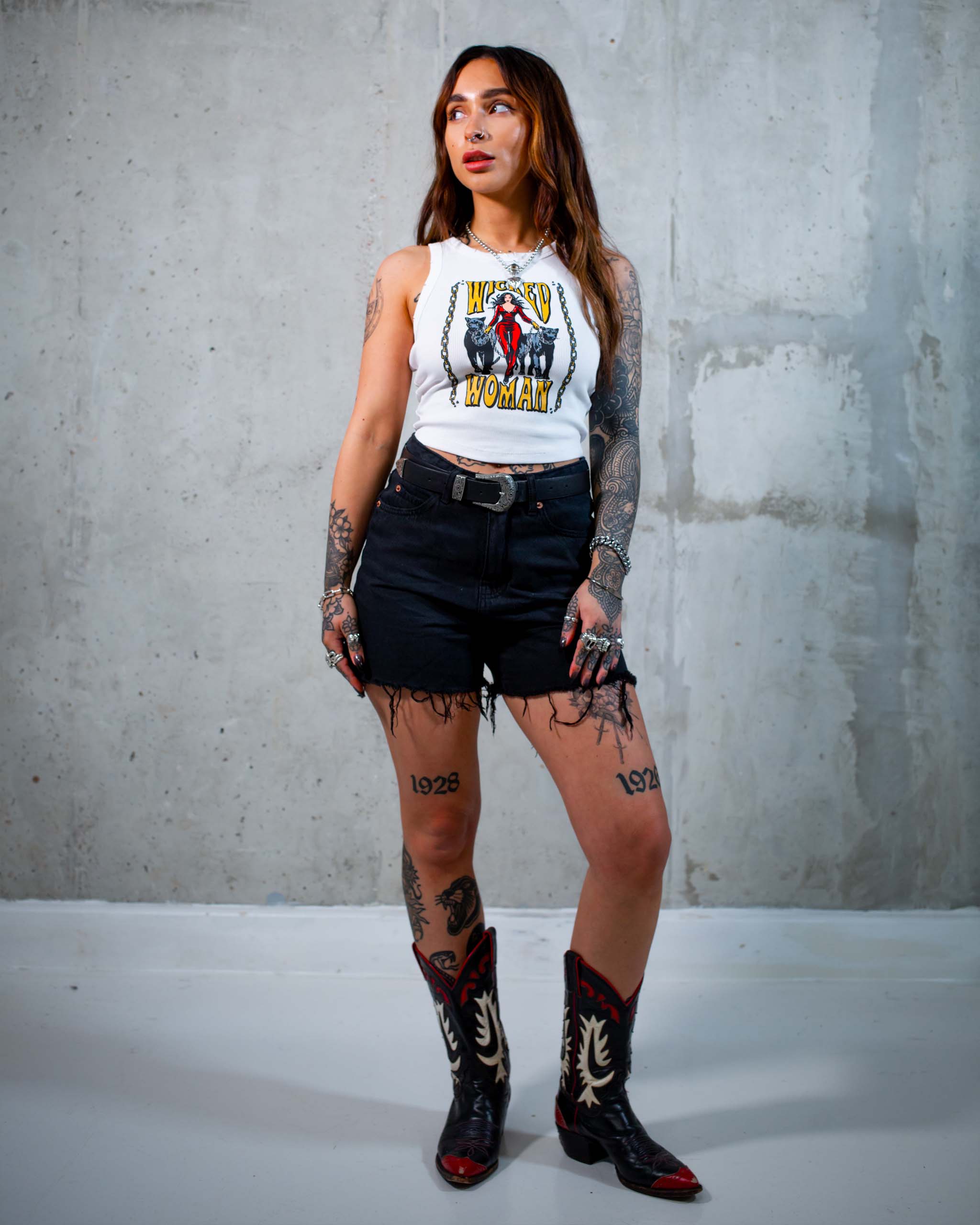 The Wicked Woman tank top by Sleazy Rider, featuring a woman in a catsuit with two panthers on a leash.