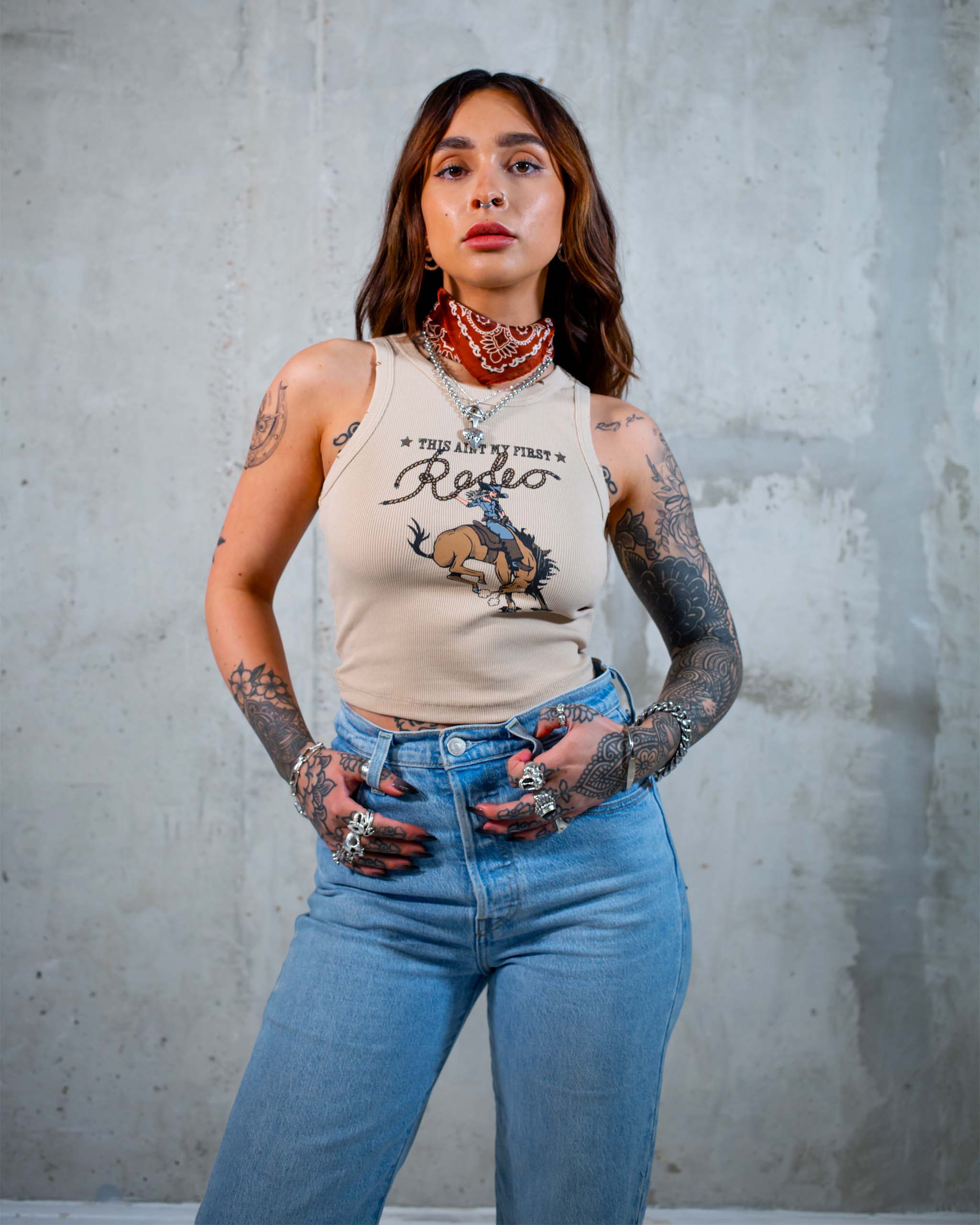 This Ain't My First Rodeo tank top by Sleazy Rider, featuring a cowgirl on a bucking wild west horse.