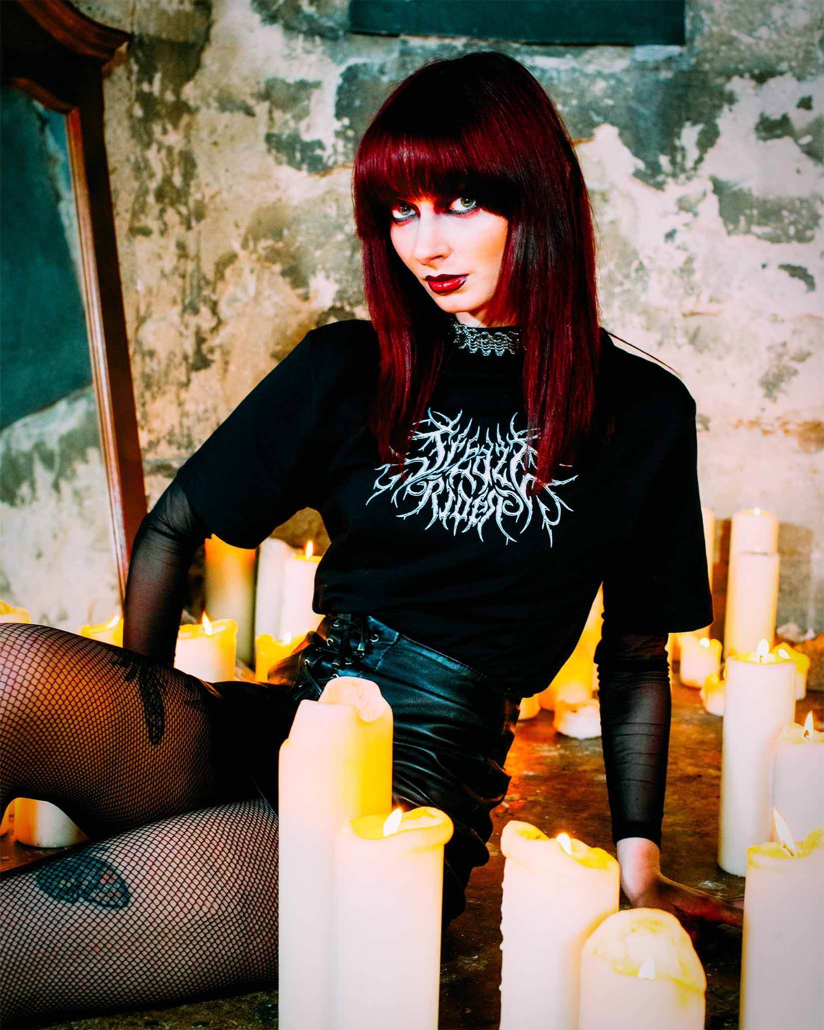 An emo girl wearing a gothic t-shirt