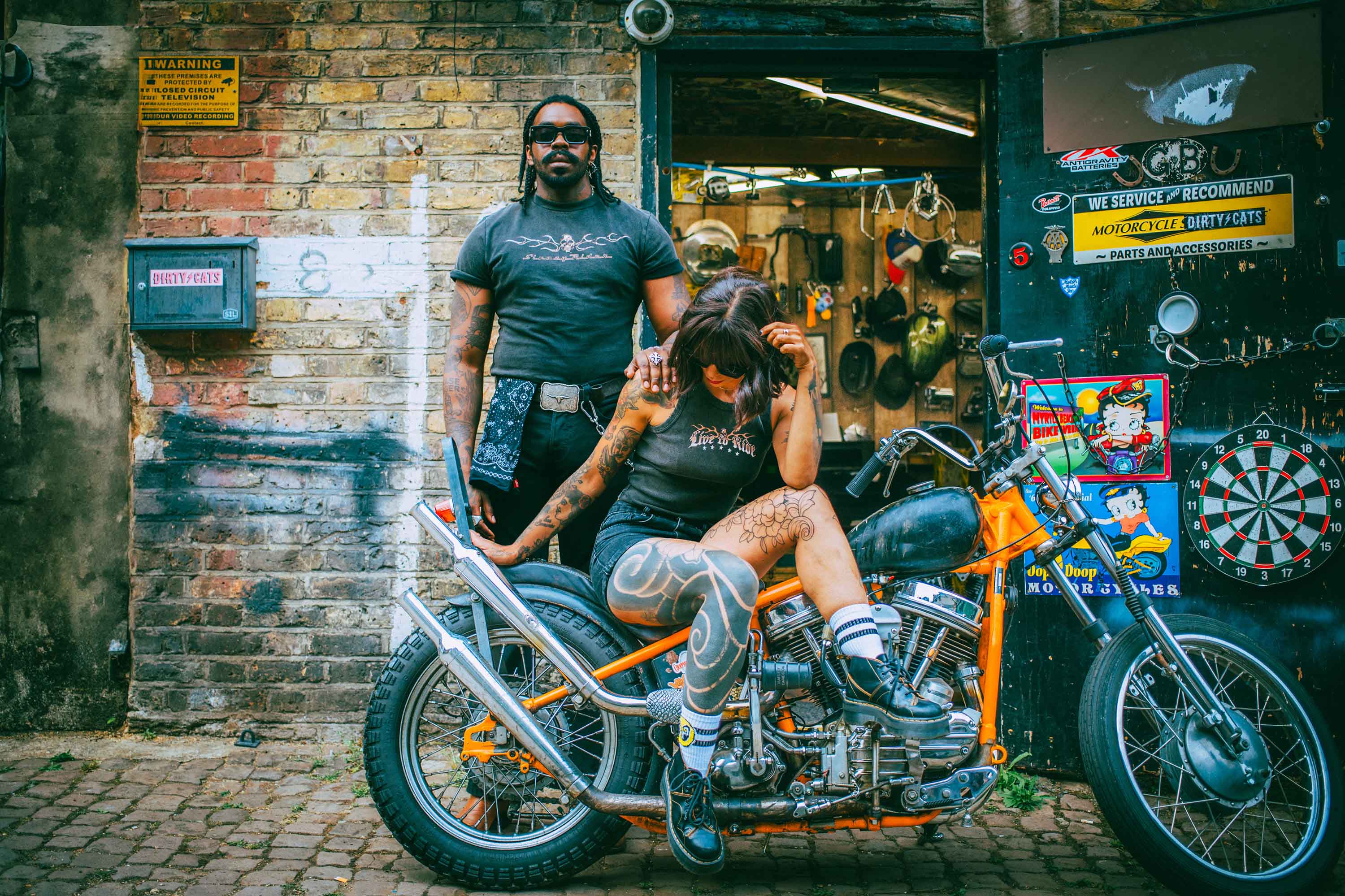 Two bikers with a vintage Harley Davidson