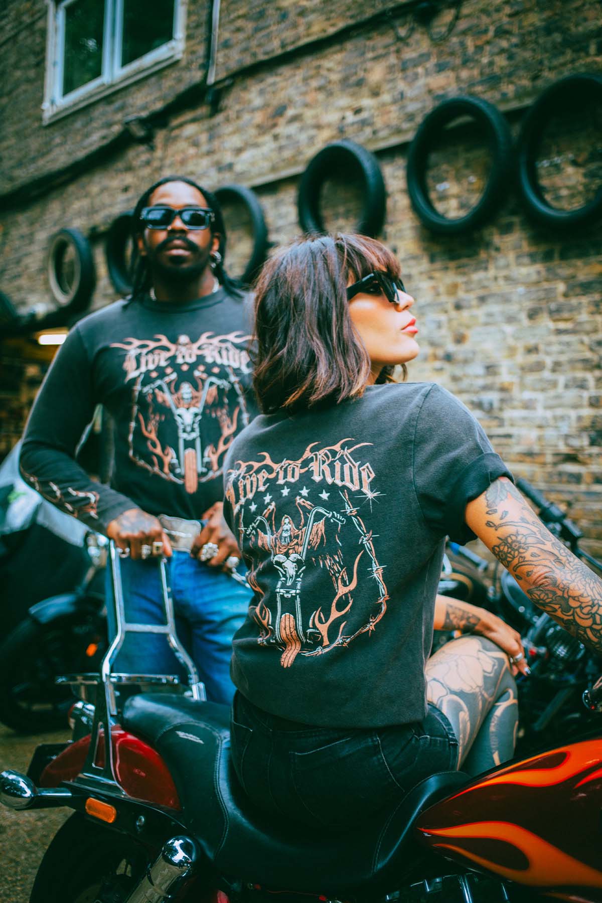 Two bikers wearing Sleazy Rider t-shirts