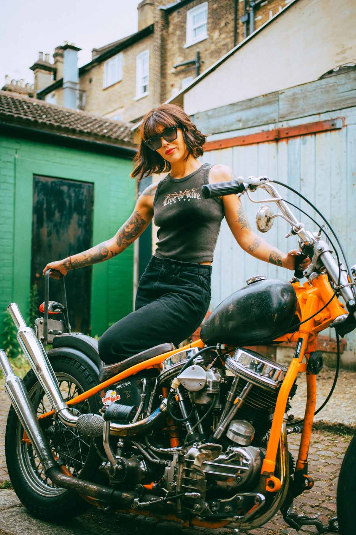 Biker chick with a Harley Davidson