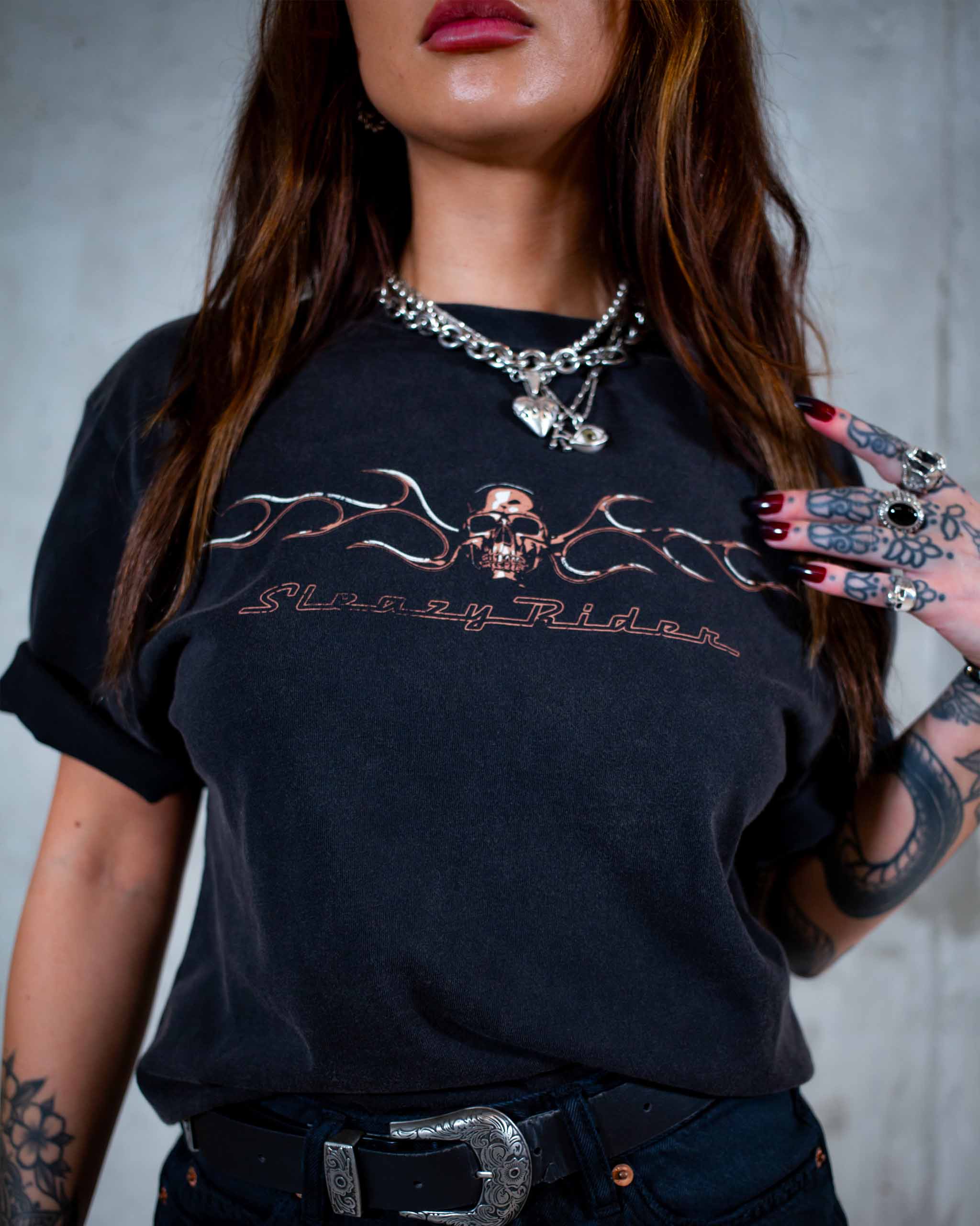 The Live To Ride biker t-shirt by Sleazy Rider. Featuring a flaming chrome skull and the grim reaper on a motorbike.