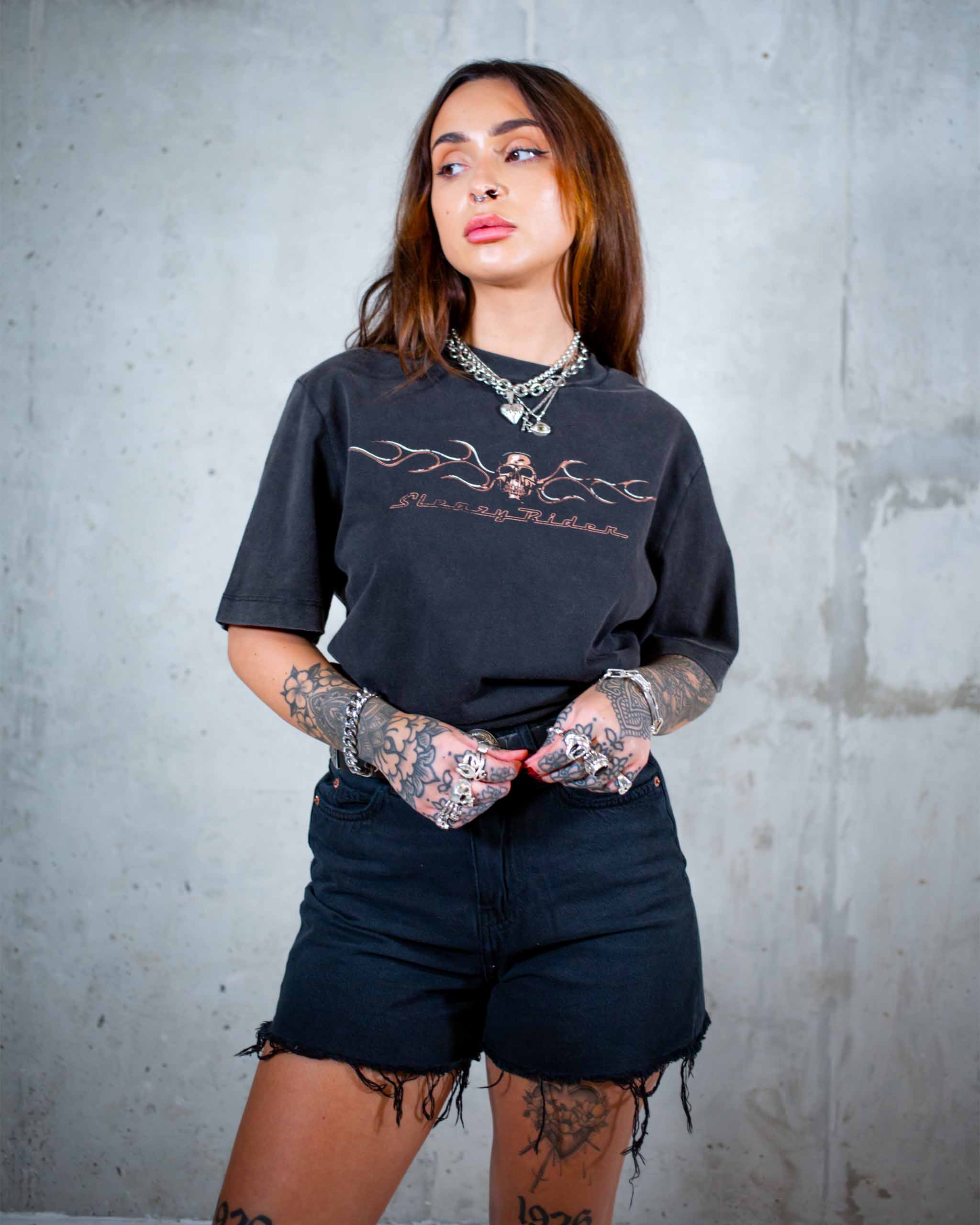 The Live To Ride biker t-shirt by Sleazy Rider. Featuring a flaming chrome skull and the grim reaper on a motorbike.