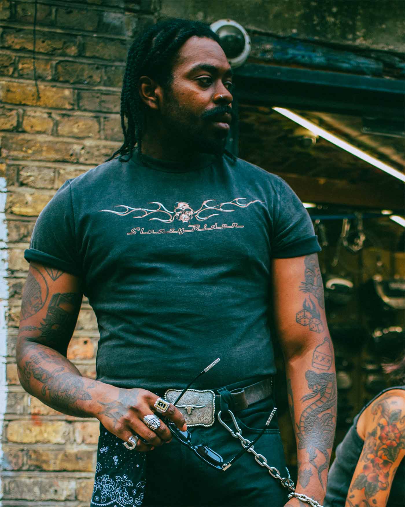 A black alternative model wearing Sleazy Rider