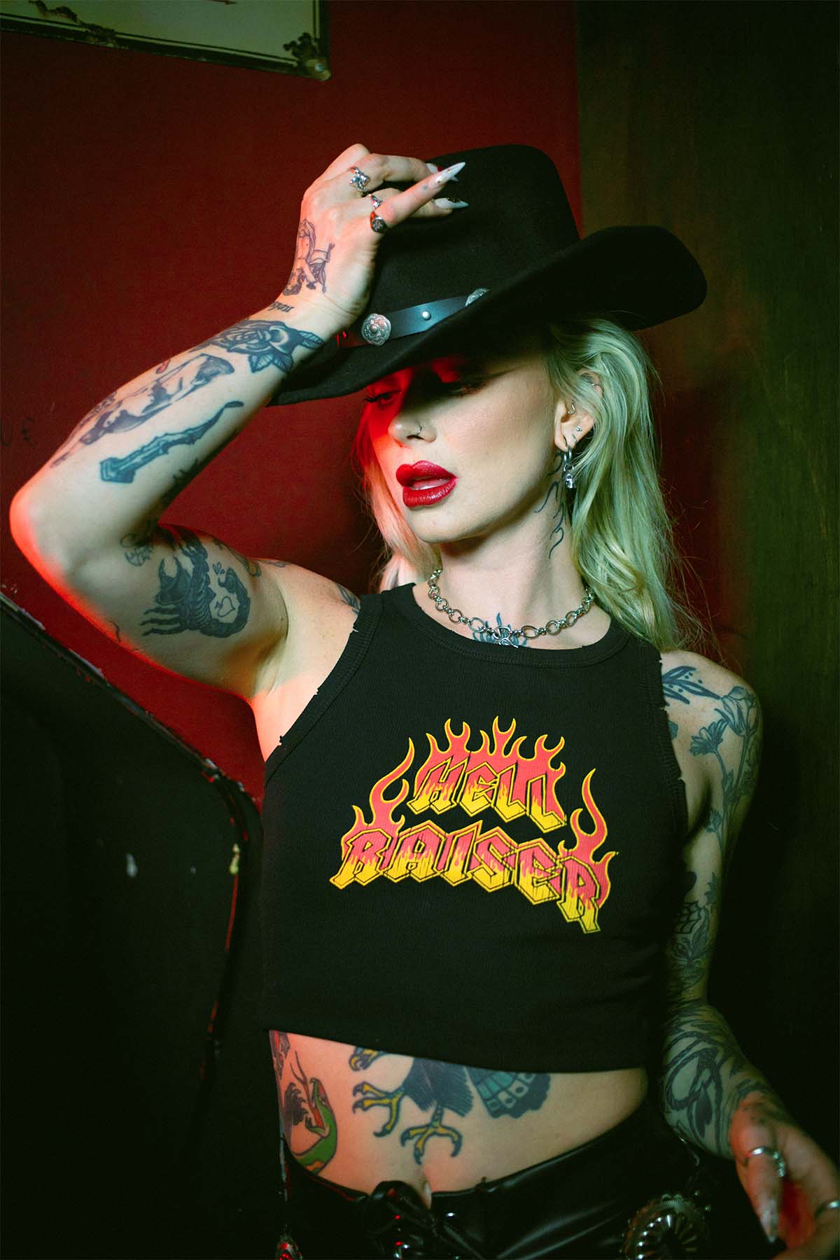 Rhianon Brailsford wearing a Sleazy Rider Hell Raiser tank top and a western gothic cowboy hat.