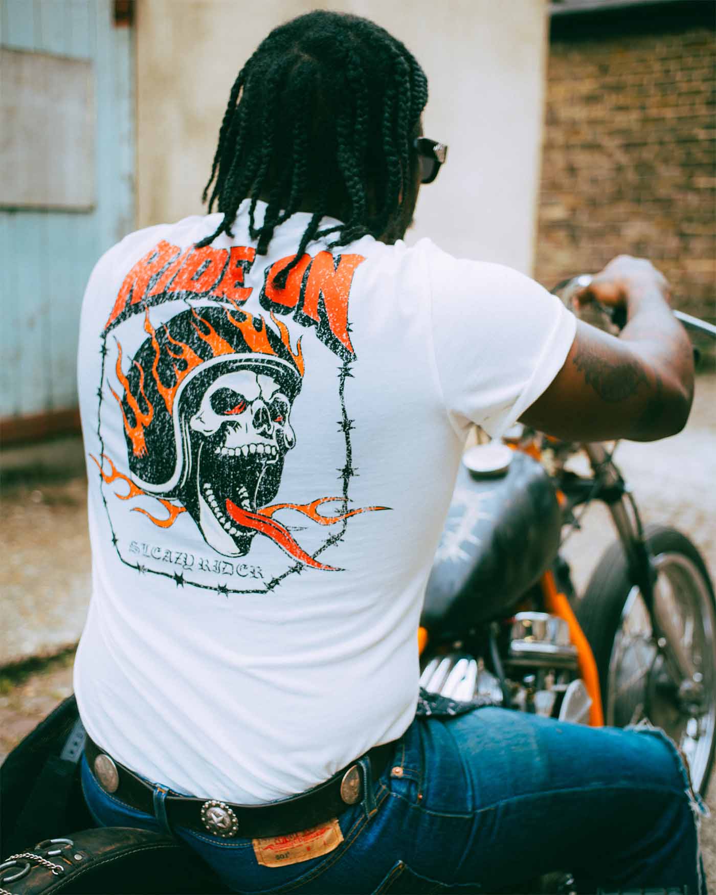 A biker wearing a Sleazy Rider t-shirt