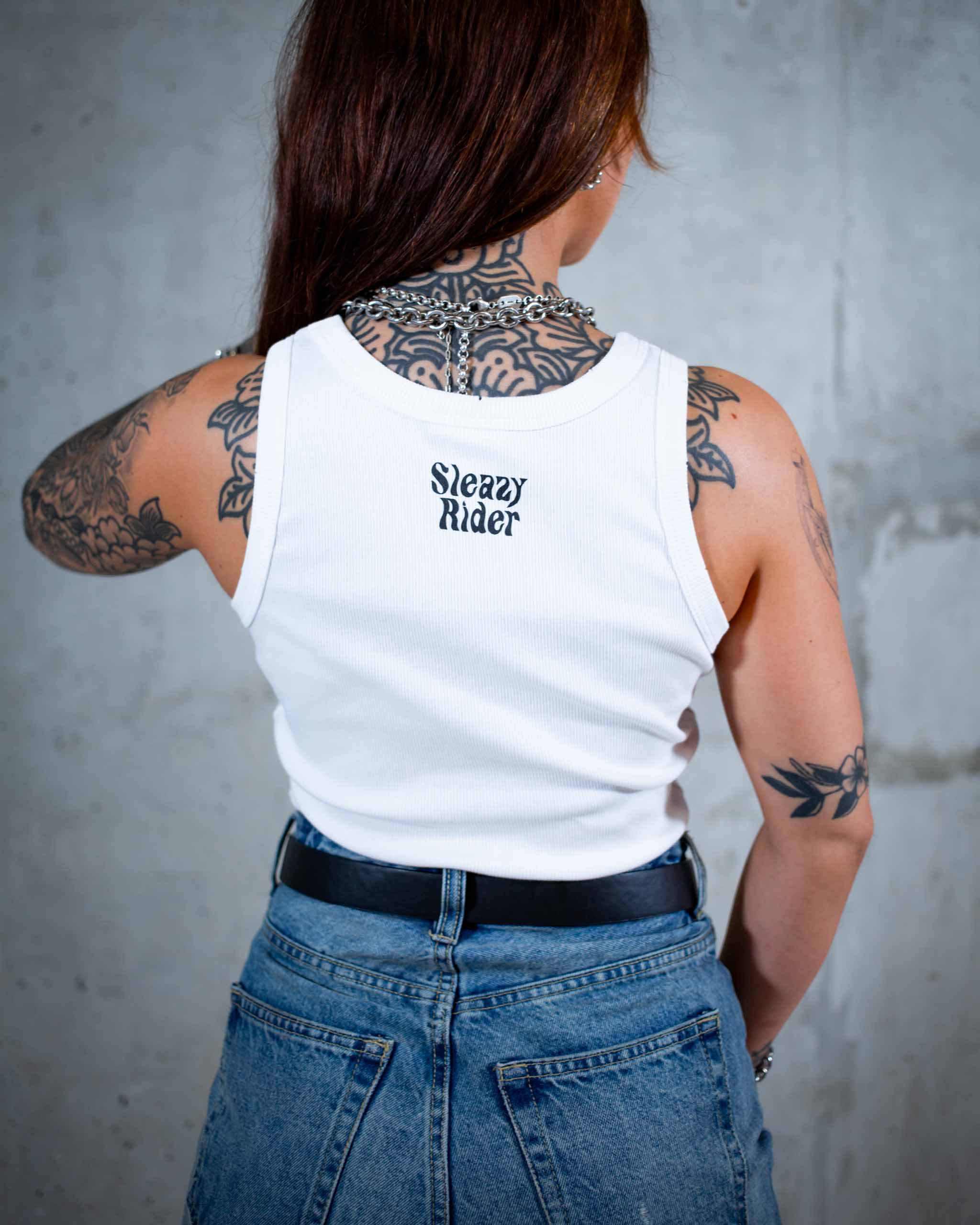 The Wildside biker tank top by Sleazy Rider. Featuring a chrome winged skull print.