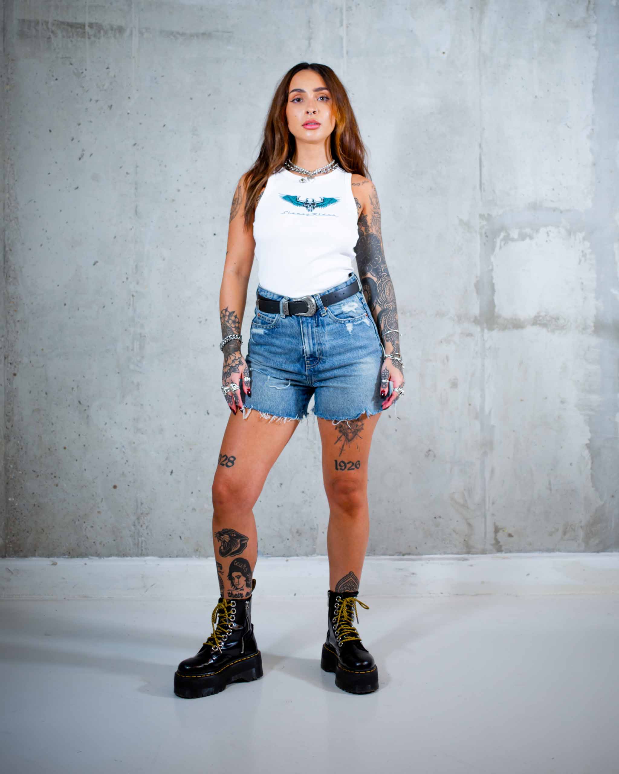The Wildside biker tank top by Sleazy Rider. Featuring a chrome winged skull print.