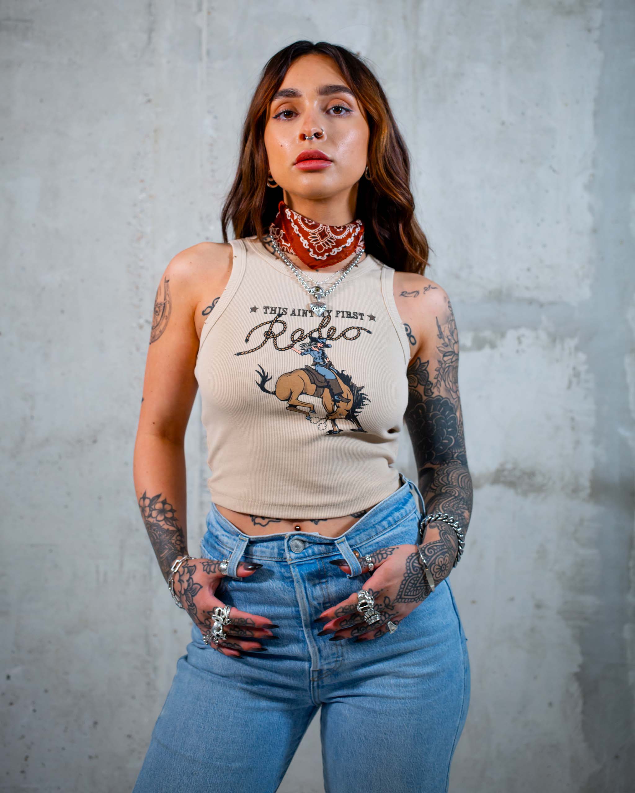 This Ain't My First Rodeo tank top by Sleazy Rider, featuring a cowgirl on a bucking wild west horse.
