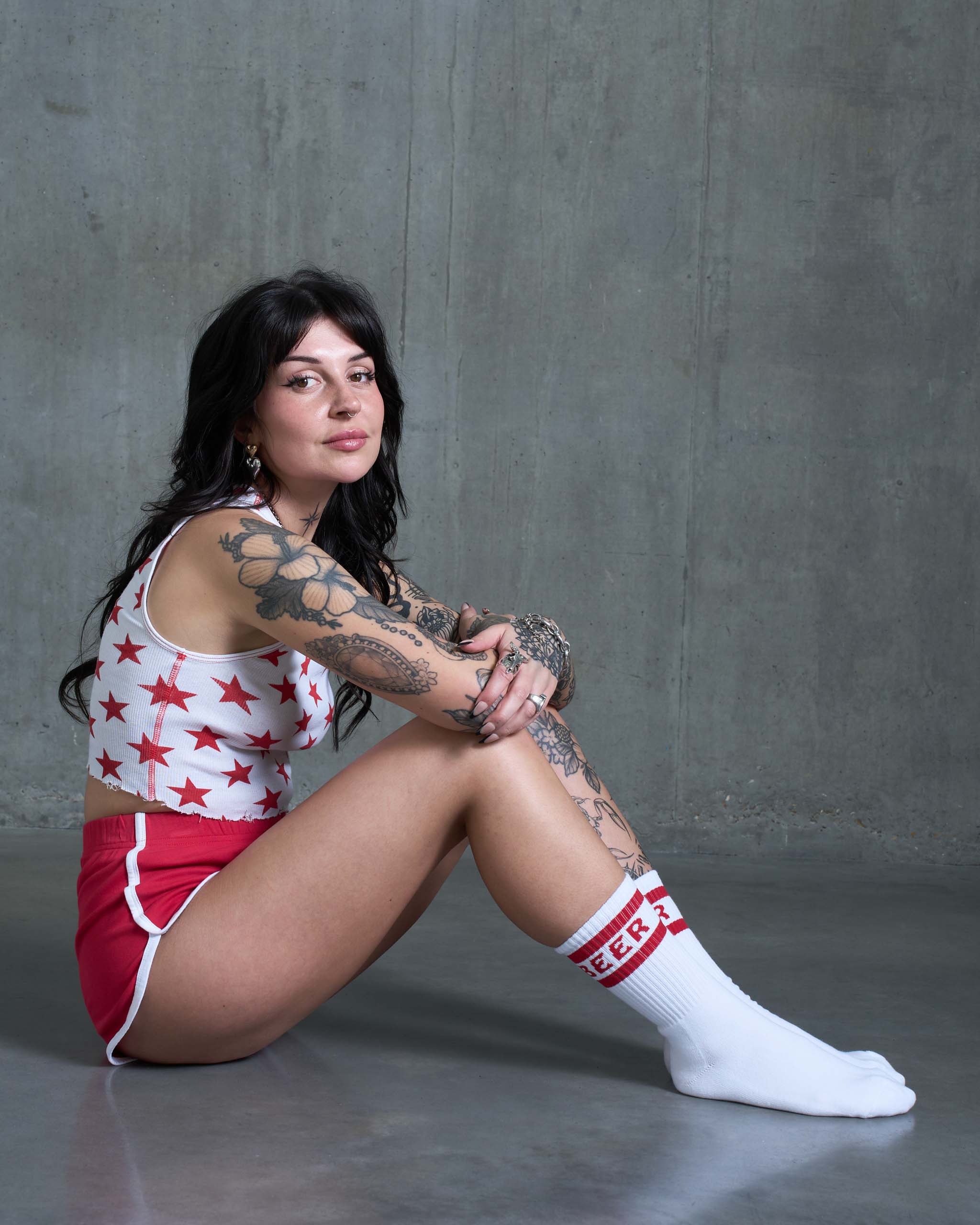 A woman wearing an 80s gym outfit.