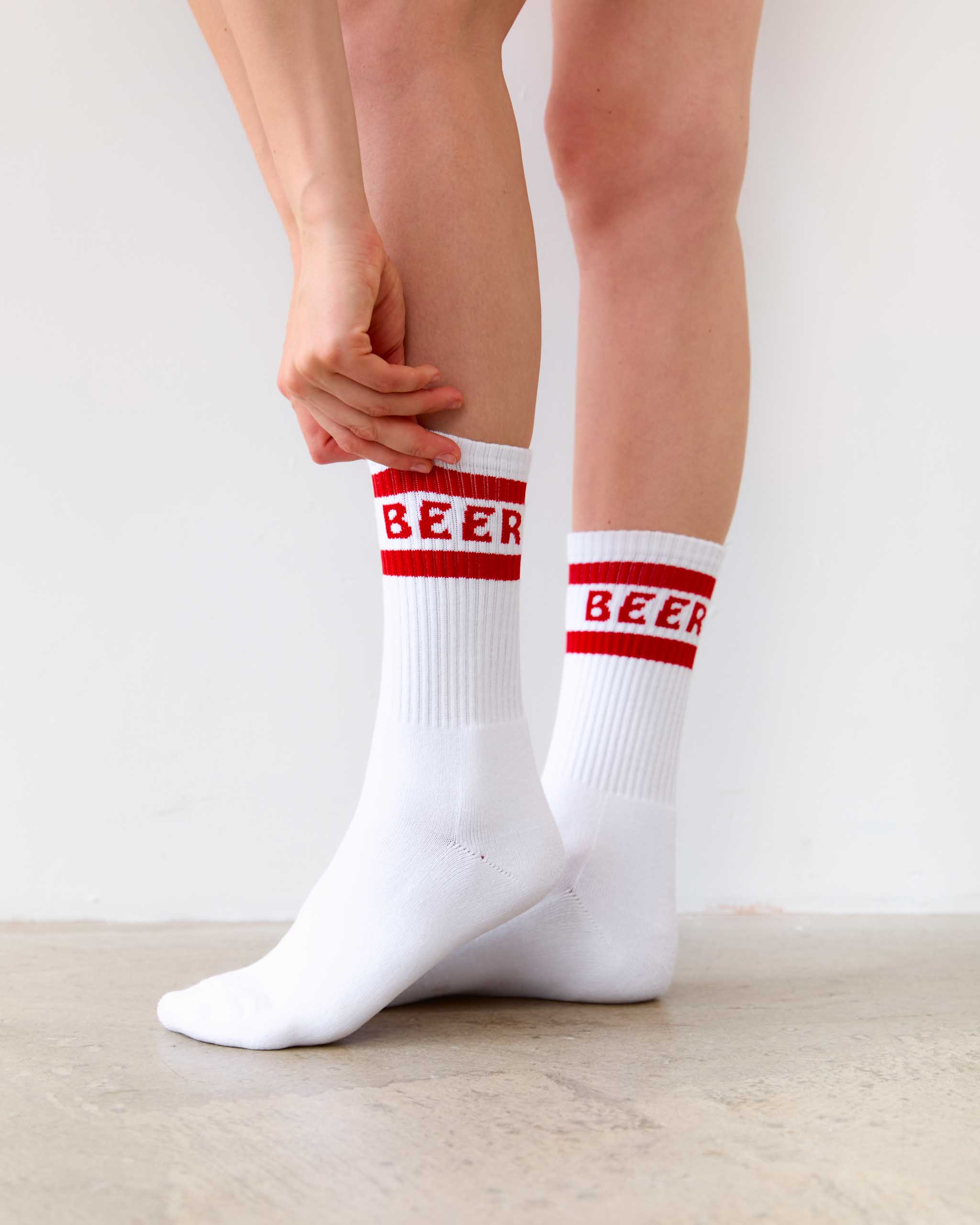 Socks with 'BEER' written on them.