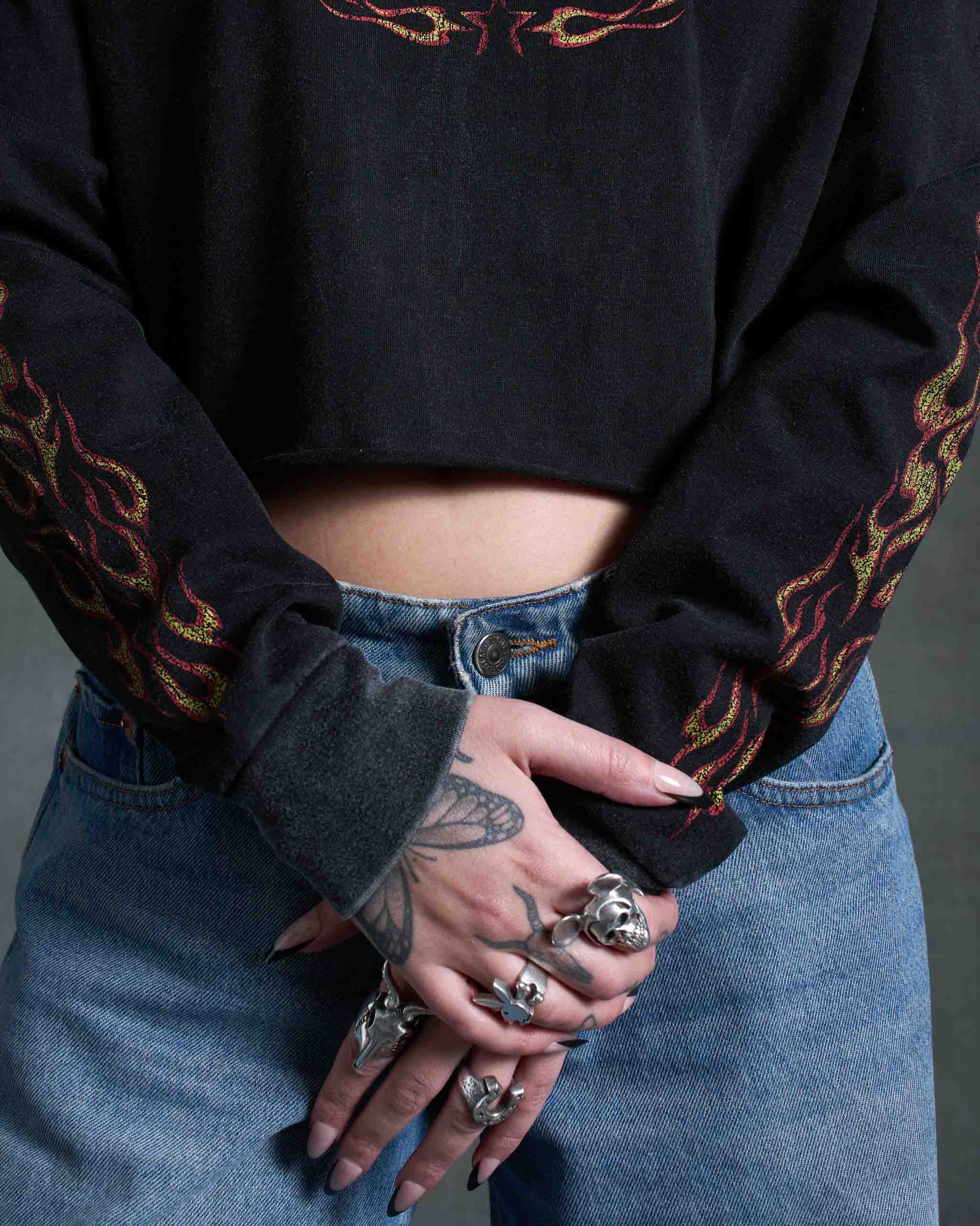 A long sleeve t-shirt with flames on the sleeves.