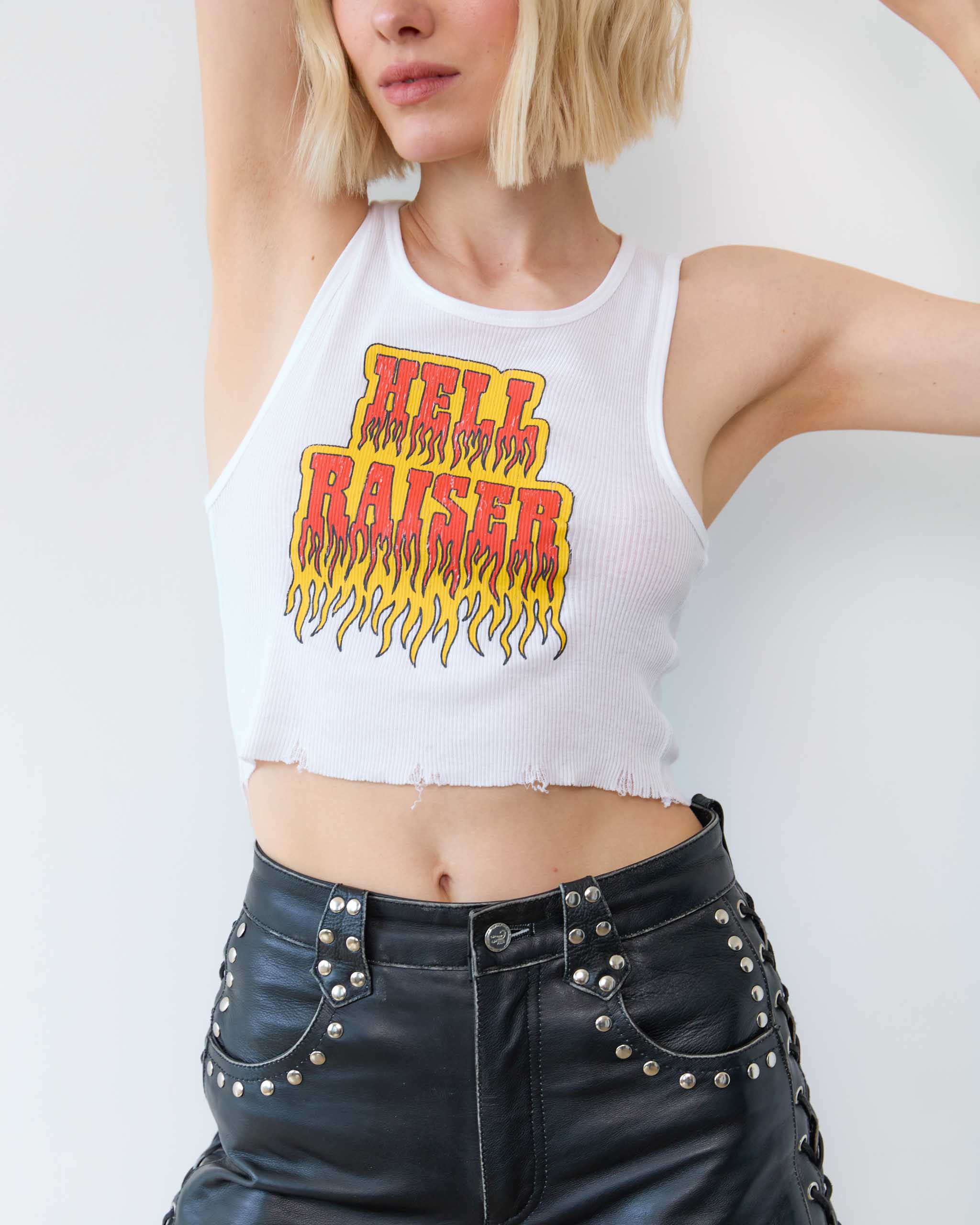 A woman wearing a 'Hell Raiser' tank top.