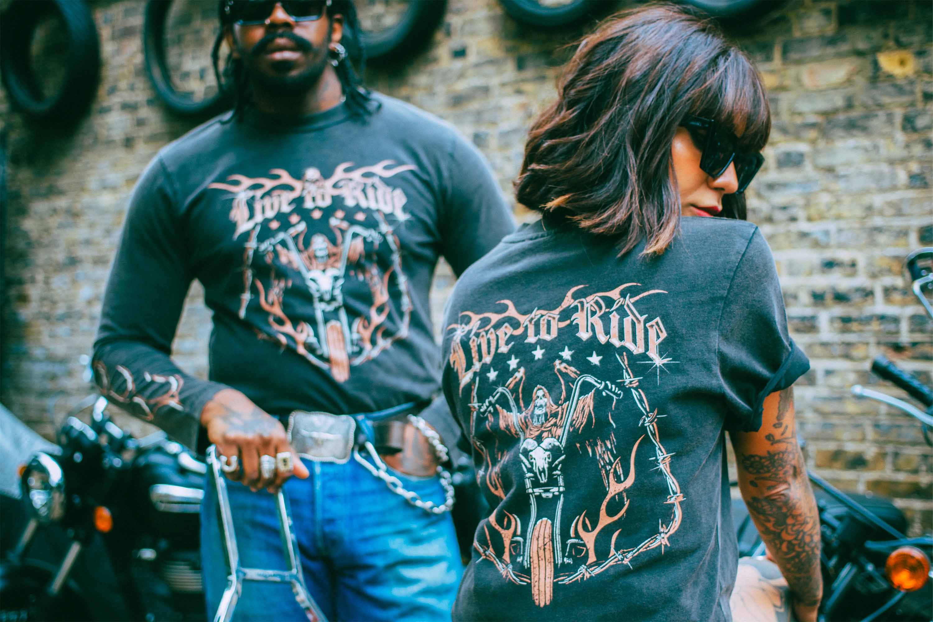 Two alternative models wearing Sleazy Rider biker t-shirts