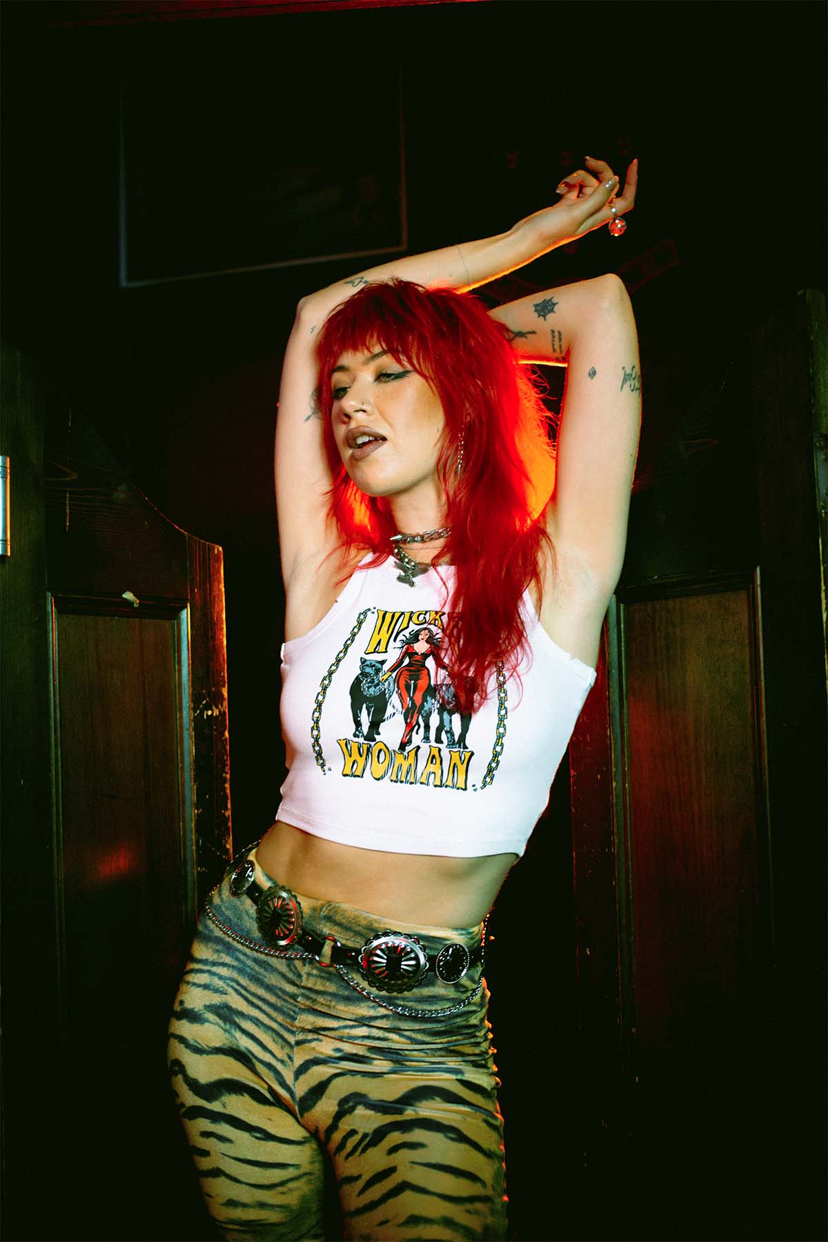 Amy Valentine wearing a Sleazy Rider Wicked Woman tank top in Slim Jim's London