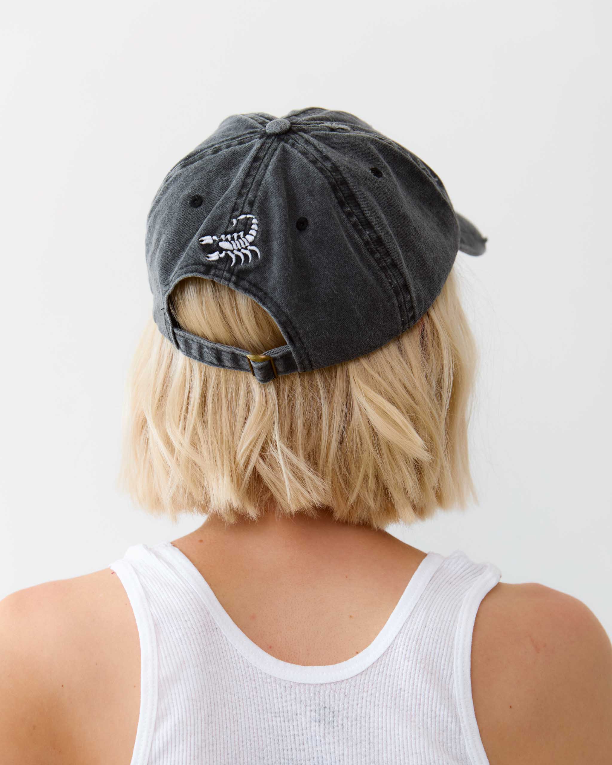 Sleazy Rider distressed cap, with scorpion embroidery on the back.